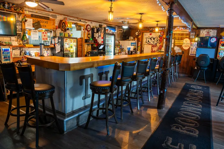Warmly lit bar and seating at Boondocks