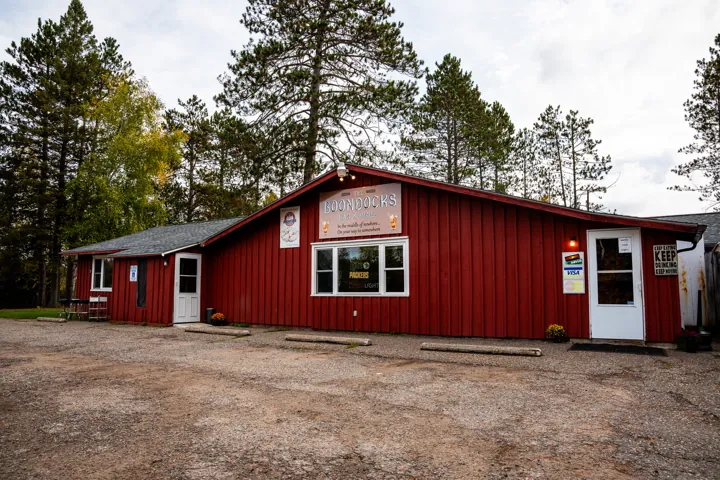 Boondocks exterior surrounded by pine trees