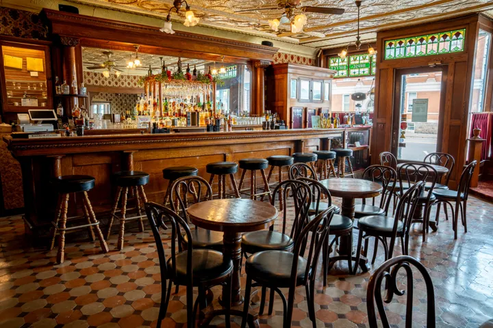 Historic bar with decorative ceiling and woodwork