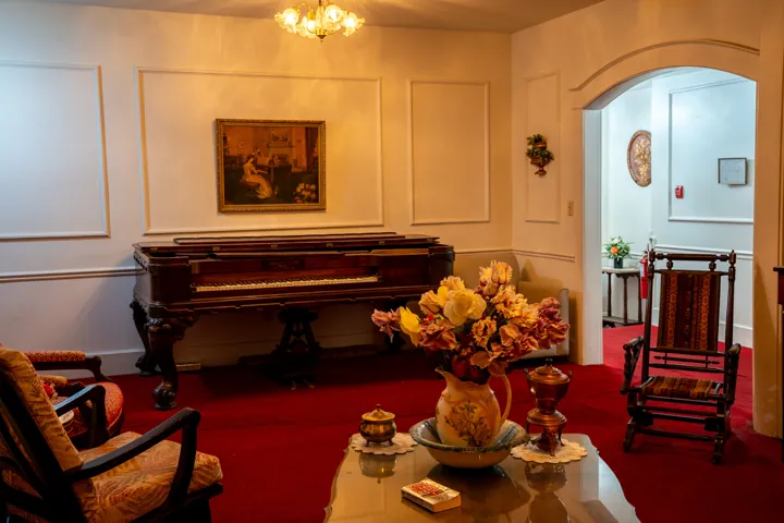 Piano and seating in a historic interior