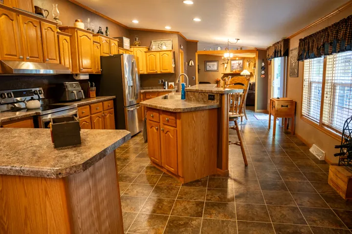 Kitchen with island and wooden cabinetry